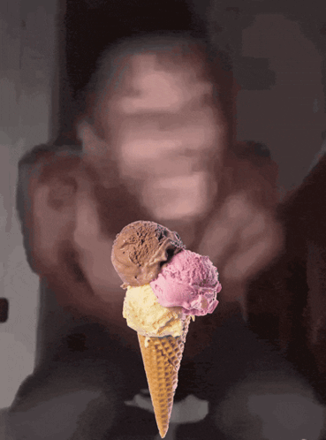 An Ice Cream Cone With Three Different Flavors On It GIF