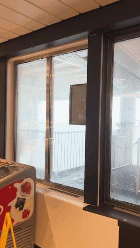 An Ice Cream Cooler With Strawberries On It GIF