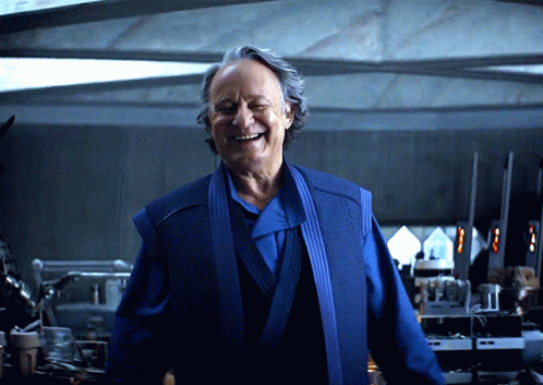 Smiling Man In Blue Robe GIF