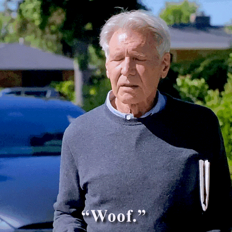 An Older Man In A Grey Sweater Says Woof GIF