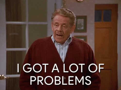 An Older Man In A Red Cardigan Says I Got A Lot Of Problems GIF