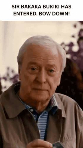 Older Man Holding Sir Bakaka Buiki Paper GIF