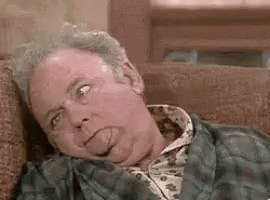 Older Man Laying On Couch With Tongue Out GIF