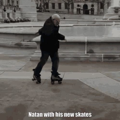 An Older Man Is Rollerblading In Front Of A Fountain And The Caption Natan With His New Skates GIF