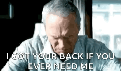 An Older Man Is Sitting At A Desk And Says `` I Got Your Back If You Ever Needed Me '' . GIF