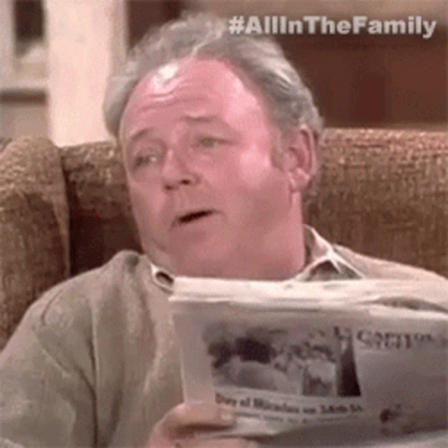 Older Man Sitting With Newspaper GIF