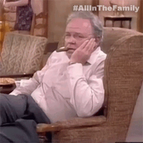 Older Man Smoking Cigar And Talking On Phone GIF