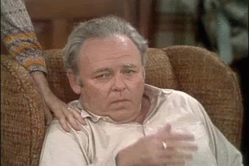 Older Man Sitting With Woman's Arm On Shoulder GIF