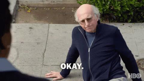 An Older Man Is Sitting On The Sidewalk And Says Okay GIF