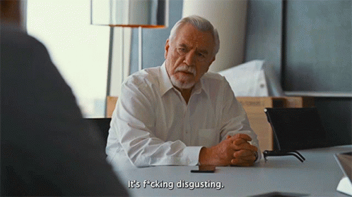 An Older Man Sits At A Table With His Hands Folded And Says It 'S F * Cking Disgusting GIF