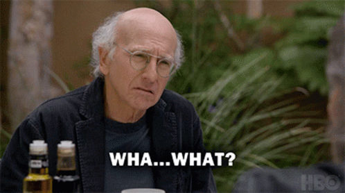 An Older Man Sitting At A Table With A Bottle Of Hbo On The Table GIF