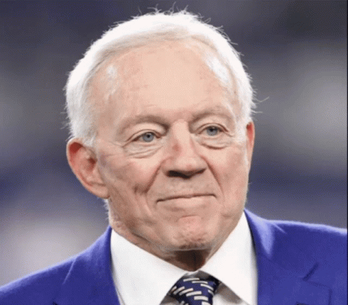 An Older Man Wearing A Blue Suit And Tie GIF