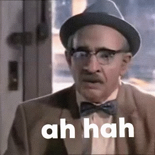 An Older Man Wearing A Hat And Bow Tie Is Making A Funny Face And Saying Ah Hah . GIF