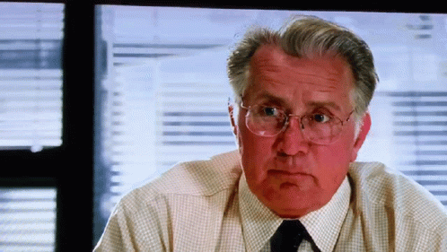 An Older Man Wearing Glasses And A White Shirt And Tie GIF