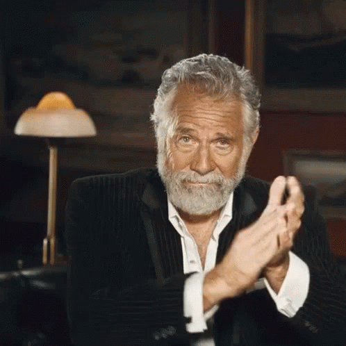 An Older Man With A Beard Is Clapping His Hands GIF