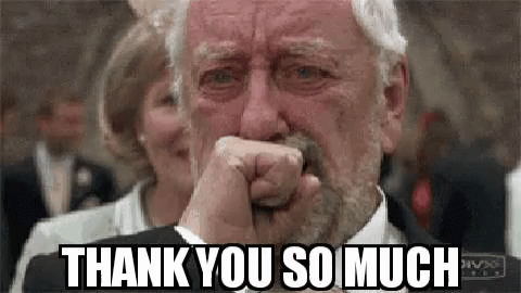 An Older Man With A Beard Is Crying And Covering His Face With His Fist . GIF