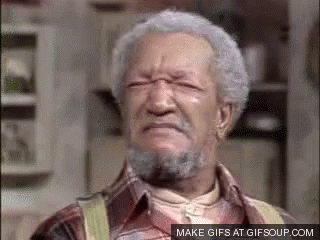 an older man with gray hair and a beard is making a face .