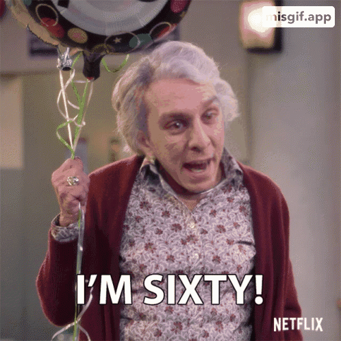 an older woman is holding a birthday balloon and says i 'm sixty