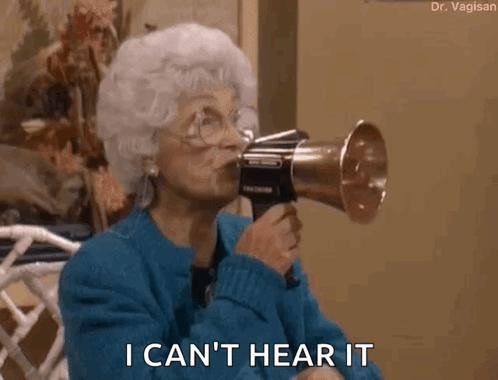 An Older Woman Is Holding A Megaphone In Her Mouth And Says I Can 'T Hear It . GIF