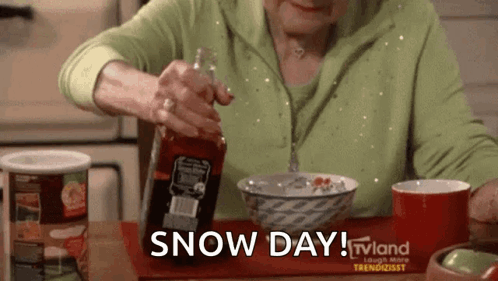 An Older Woman Is Sitting At A Table With A Bowl Of Cereal And A Bottle Of Sauce . GIF