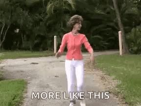 An Older Woman Is Walking Down A Path With The Words `` More Like This '' . GIF