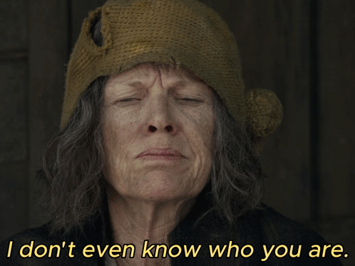 An Older Woman Wearing A Knitted Hat Says I Don 'T Even Know Who You Are GIF