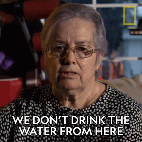 An Older Woman With Glasses Says We Don 'T Drink The Water From Here GIF