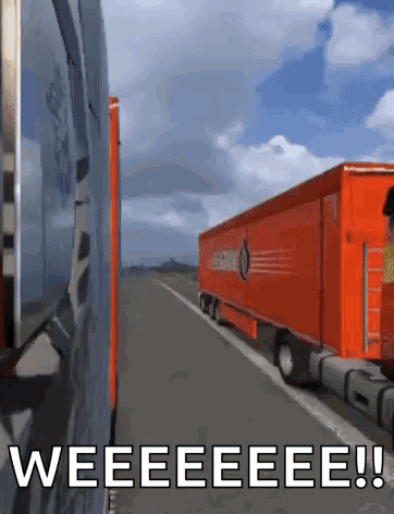 An Orange Semi Truck Is Driving Down A Highway With The Words " Weeeeeeeee " Written On The Bottom GIF