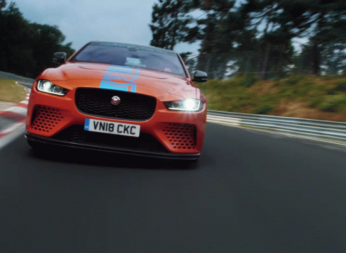 an orange sports car with the license plate vni8 ckc
