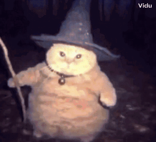 An Owl Wearing A Wizard Hat And Holding A Staff GIF