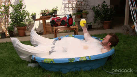 Andy Dwyer Bathing In Inflatable Swimming Pool GIF