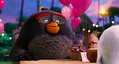 Angry Bird Sitting at Table with Pink Balloons