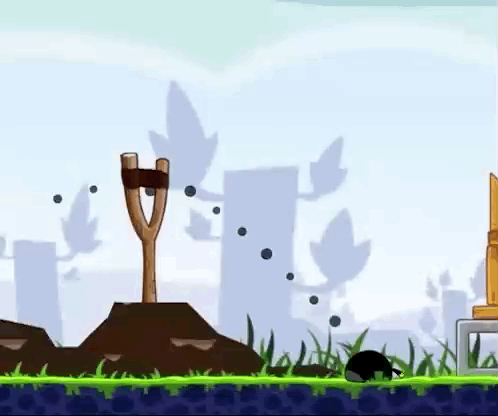 Angry Birds Game With Slingshot In Field GIF