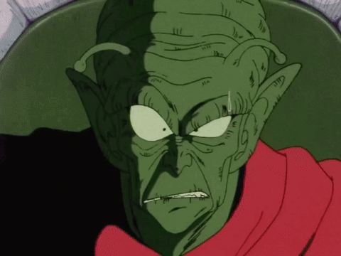 Angry Green Cartoon Character With Red Scarf