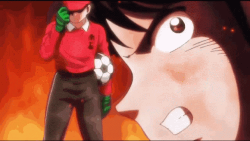 Angry Man in Red Shirt Holding Soccer Ball