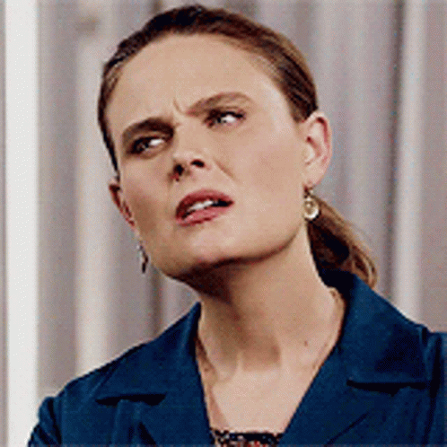 Angry Woman in Blue Jacket and Earrings