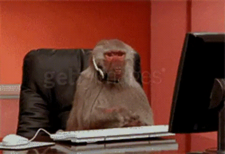 Angry Working Monkey Typing GIF