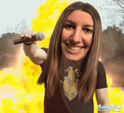 Animate Me Shows A Woman Holding A Microphone In Front Of A Fire GIF
