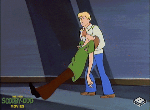 Animated Fred Pushing Passed Out Shaggy GIF