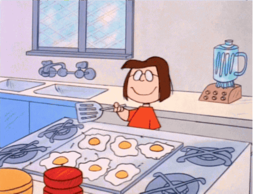 Animated Girl Wearing Glasses Cooks Egg Dog GIF