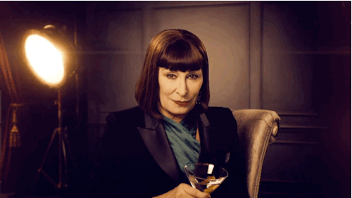 Anjelica Huston Tossing Drink GIF