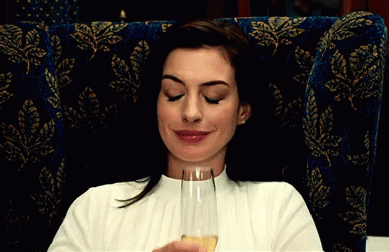 Anne Hathaway Holding Champagne Glass GIF