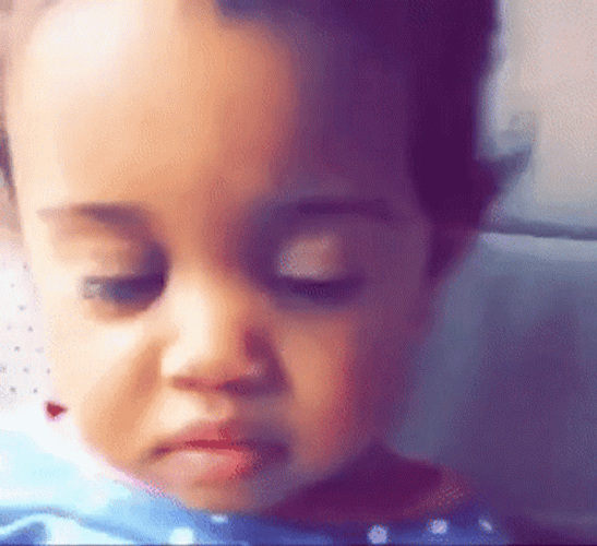 Annoyed Baby Girl Rolls Eyes GIF
