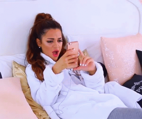 Annoyed Niki Demartino Throwing Phone GIF