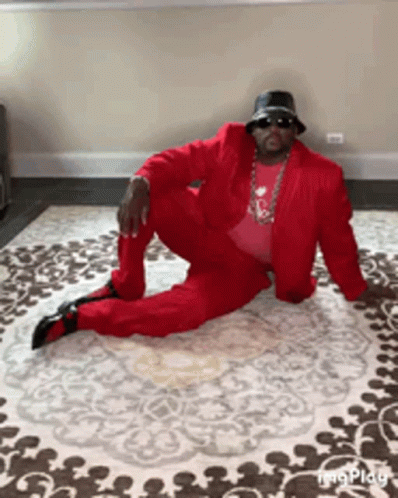 Anthony Adams In Red Suit Windmill Breakdance GIF