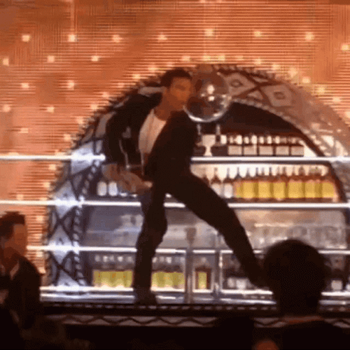 Antonio Banderas Standing On Top Of Bar Counter GIF
