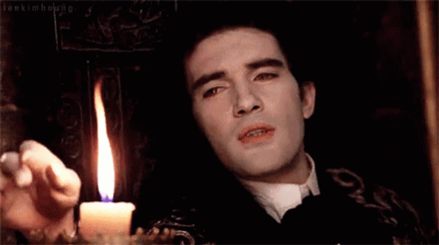 Antonio Banderas Touching The Candle Fire GIF
