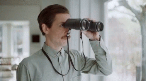 Antonio Desai Putting Down Binoculars GIF