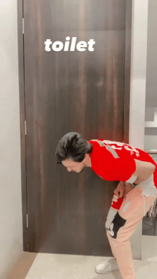 Anxious Man Waiting Outside Toilet GIF