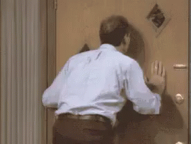 Anxiously Waiting Behind The Door GIF